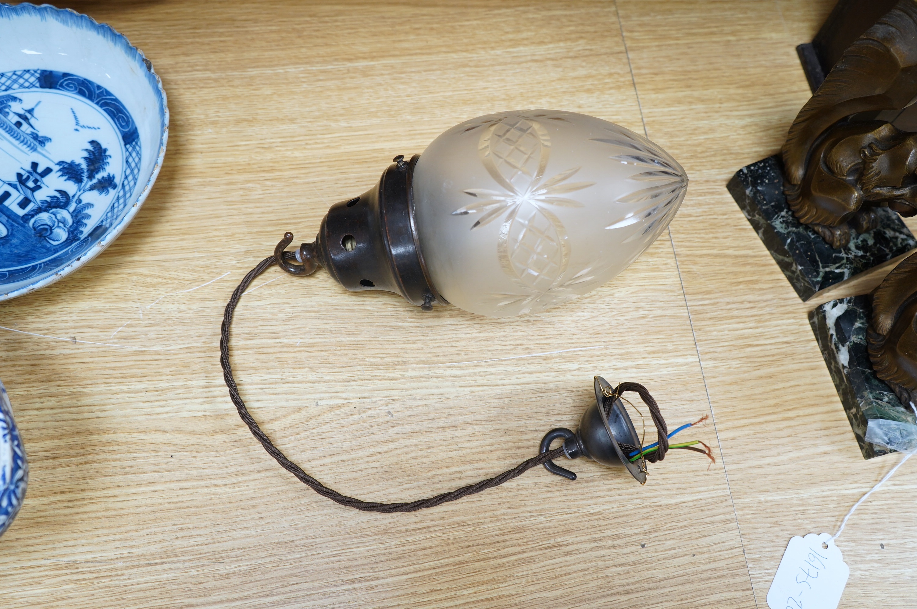 An English 1920’s frosted with clear cut crystal acorn pendant with gilded bronzed fitting, chain and ceiling rose, wired, glass including gallery 25cm high, 12cm across. Condition - good.